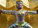 Bangkok 04 03 Wat Phra Kaeo Golden Phra Siratana Chedi Demon Here is the detail of one of the demons supporting the golden chedi at Bangkoks Wat Phra Kaeo.